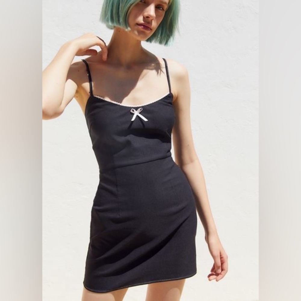 Black mini dress with pink bow
